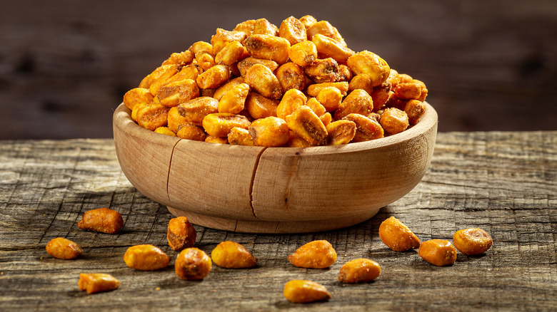 bowl of corn nuts sitting on a table