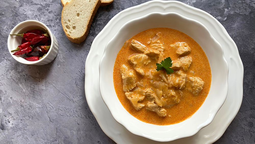 Chicken paprikash in white bowl