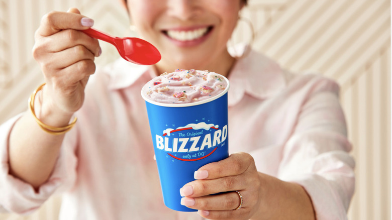 Person holding Frosted Animal Cookie Blizzard
