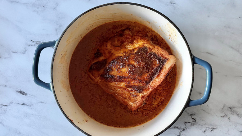 Pork butt and liquid in Dutch oven