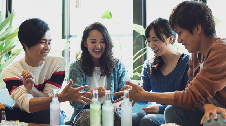 friends playing games with drinks