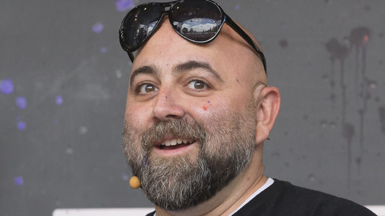 Duff Goldman excitedly holding food