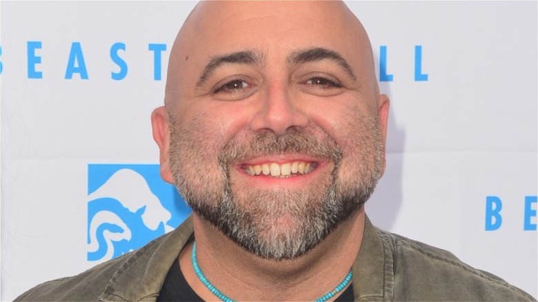 Duff Goldman smiling on red carpet