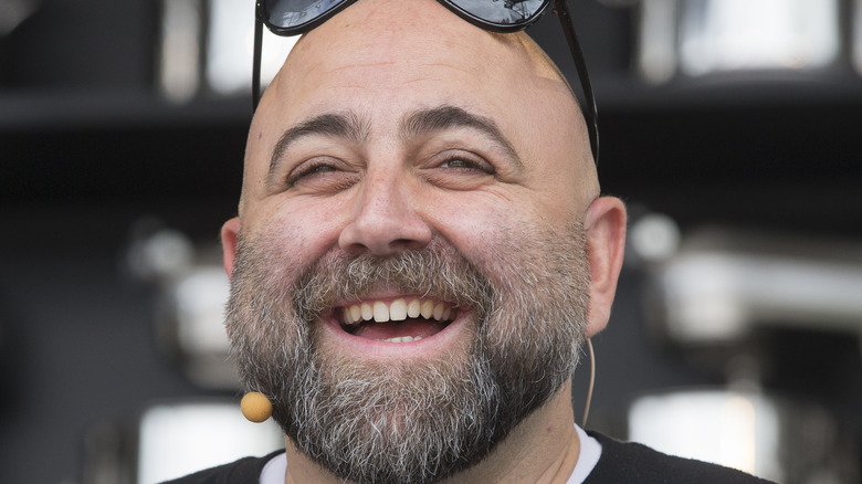 Close up of Duff Goldman wearing sunglasses and smiling