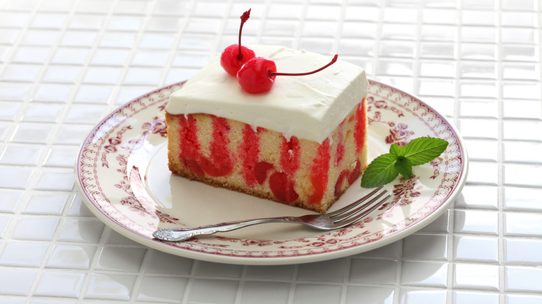 Cherry poke cake on plate 
