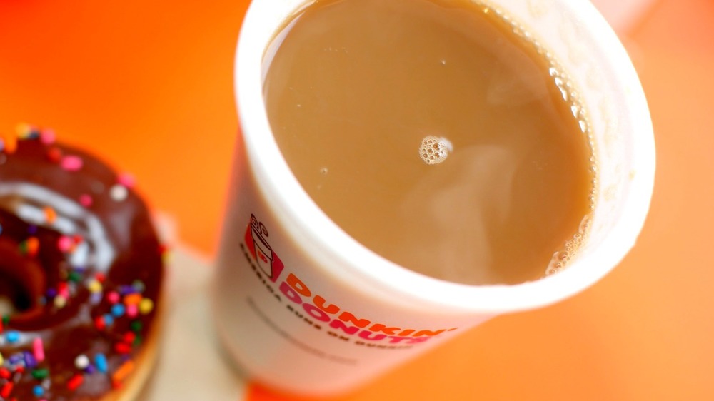 Cups of Dunkin' Donuts hot coffee and iced coffee