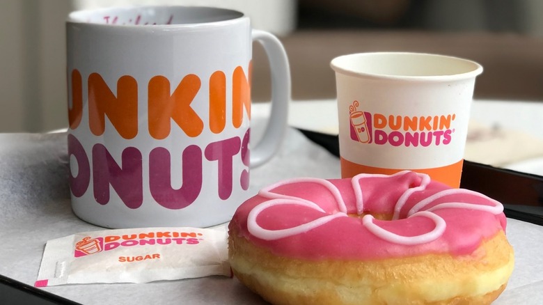 Dunkin' drinks with Dunkin's donut and Dunkin's sugar.