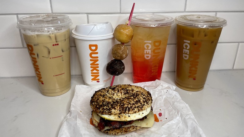 Four drinks, breakfast sandwich, and donut bites