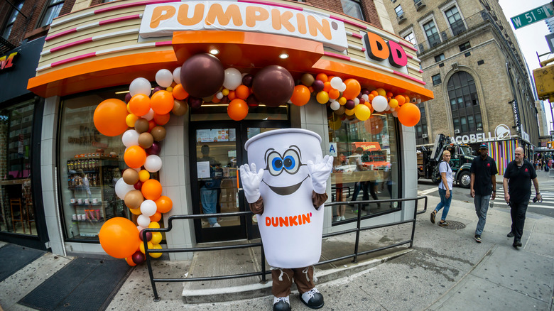 Dunkin' Pumpkin Season Decor at exterior of restaurant