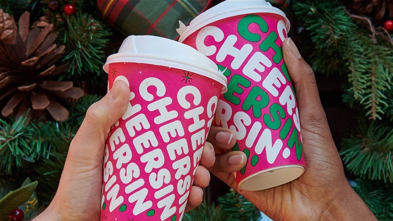 toasting with Dunkin' holiday cups