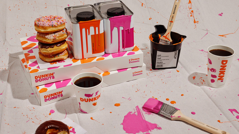 Dunkin' doughnuts and coffee with pink and orange Backdrop paint and paint splatters