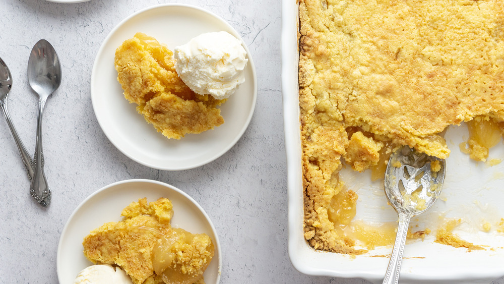 easy 3-ingredient apple dump cake on plates with ice cream 