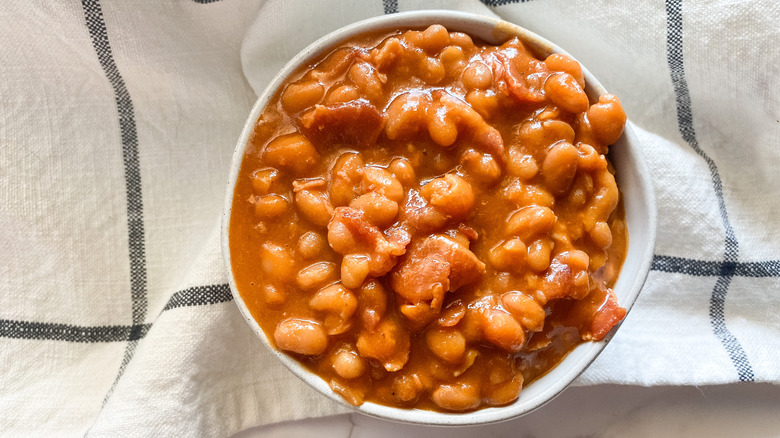 Easy baked beans with bacon on bowl 