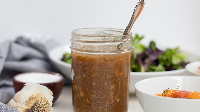 dressing in jar with spoon