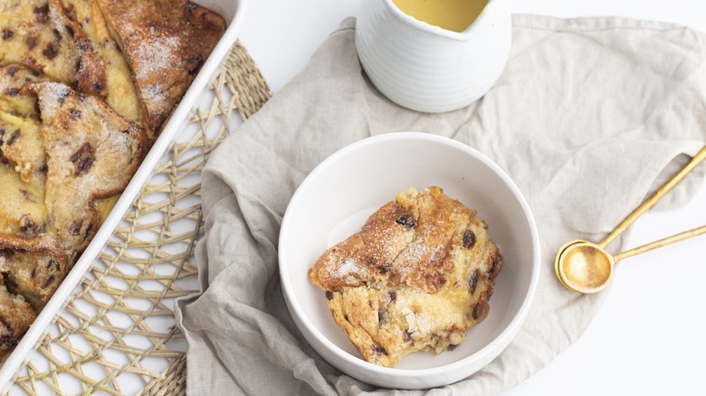 Bread and butter pudding in a dish with custard