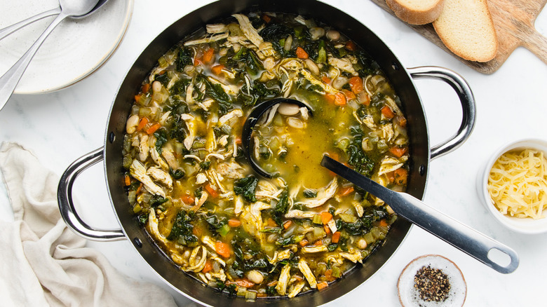 Chicken vegetable pesto soup in pot