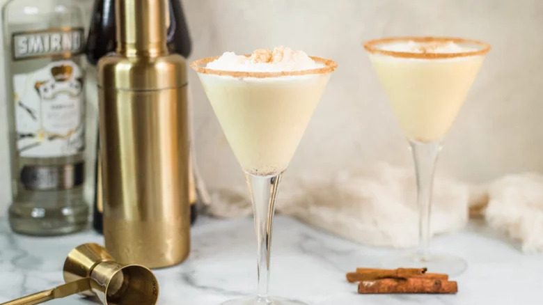 Two martinis with a cocktail shaker