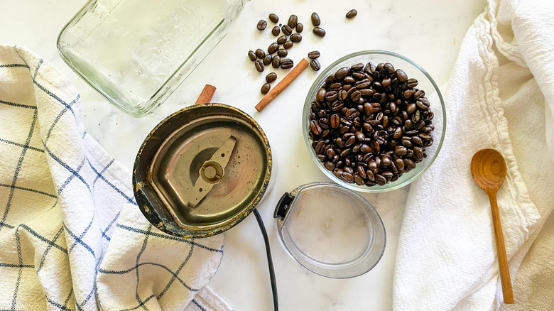 whole coffee beans with coffee grinder
