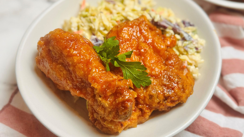 Honey BBQ fried chicken on plate with coleslaw