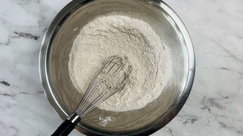 Whisk and flour in bowl