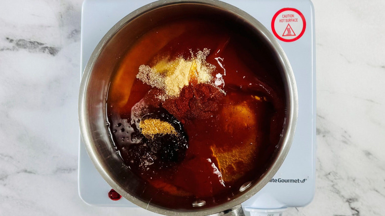 Various barbecue sauce ingredients in saucepan