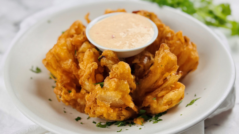 Texas Roadhouse Cactus Blossom with dipping sauce in middle