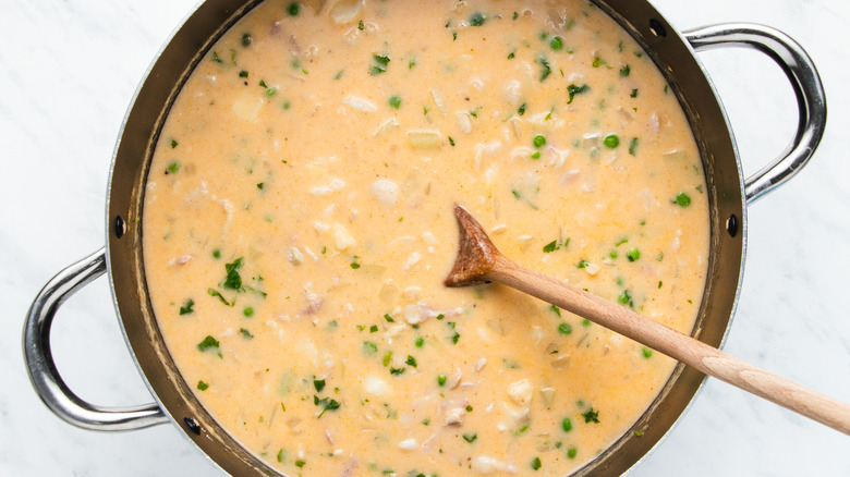soup in pot with spoon