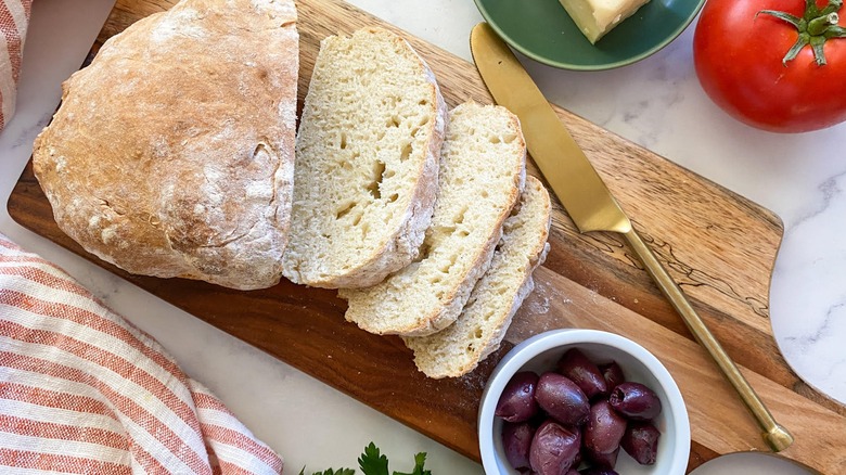 ciabatta bread on cutting board 