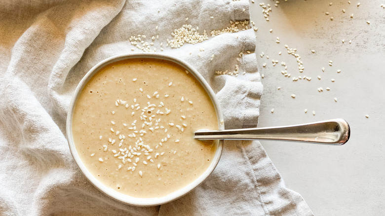 tahini in bowl on towel