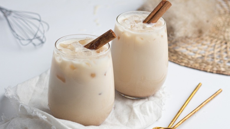 Glasses of horchata with cinnamon sticks