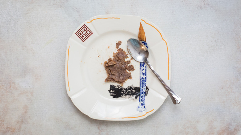 mashed anchovy on colorful plate