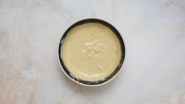Caesar dressing in small bowl