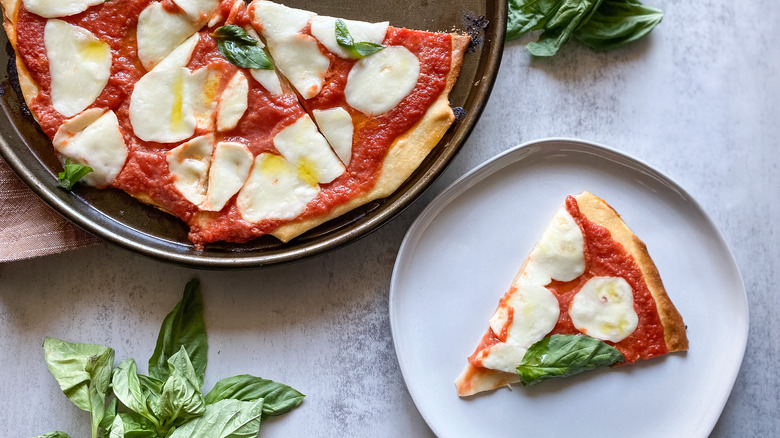 margherita pizza slice with basil