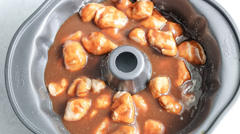 wet ingredients poured over dough