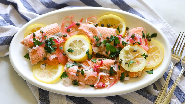 poached salmon with lemon slices