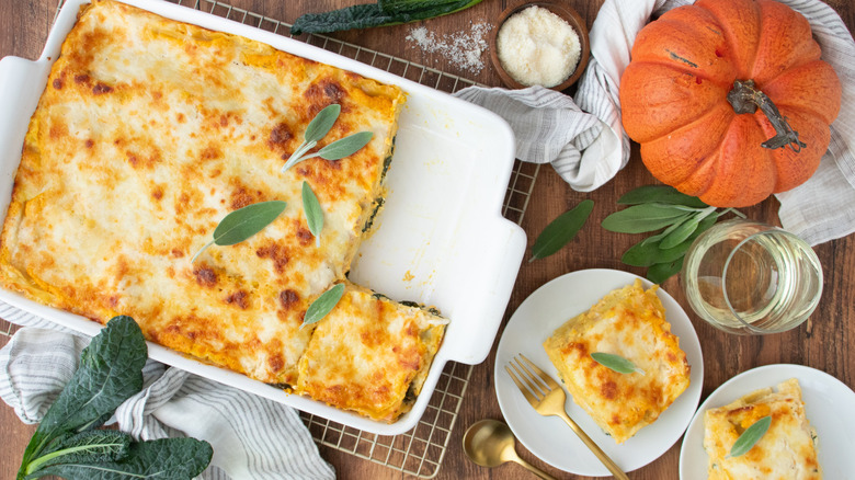 Pumpkin lasagna in casserole dish with two slices on plates