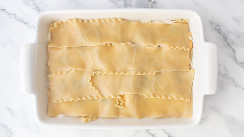Lasagna noodles layered in casserole dish
