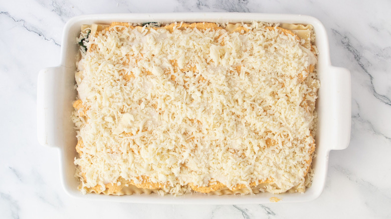 Pumpkin lasagna topped with shredded cheese
