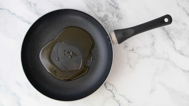 Drizzle of oil in skillet