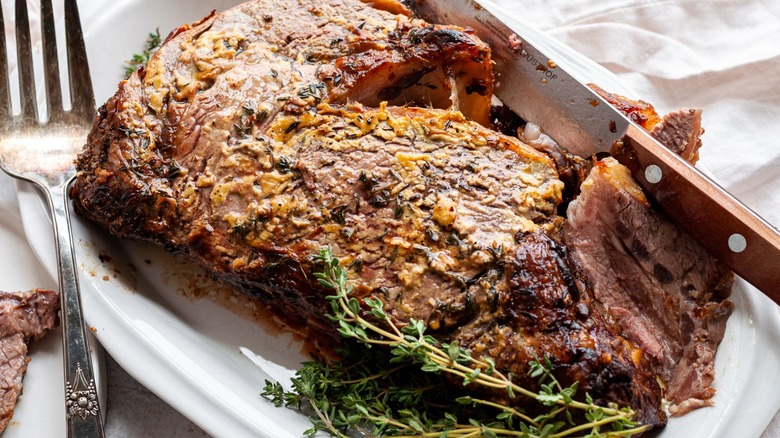 roast beef with herb garnish