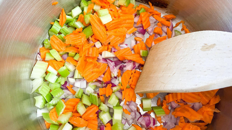 Carrots, celery, and onion cooking in a pot
