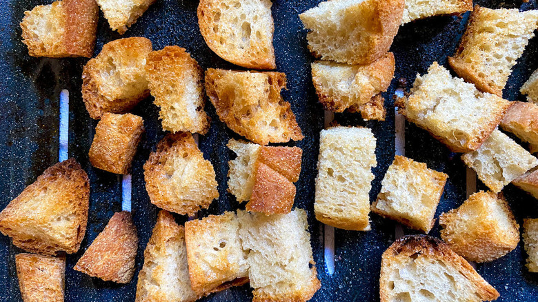 Bread chunks on a baking dish
