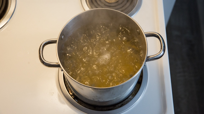 noodles cooking in medium pot