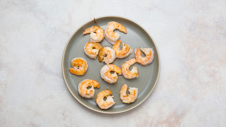 seared shrimp on green plate