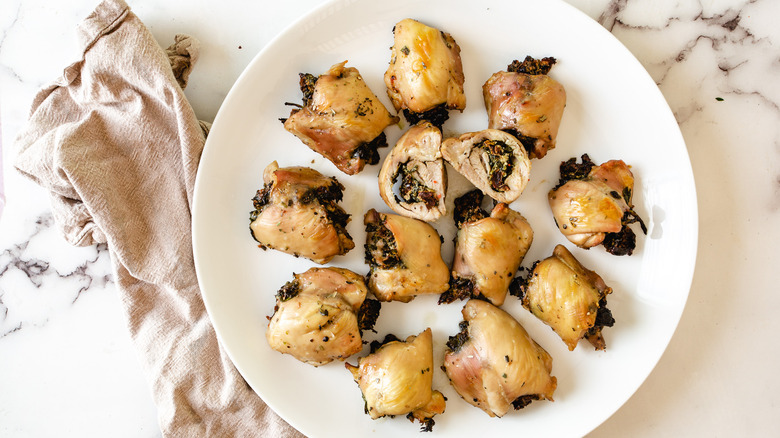 stuffed chicken thighs on a platter