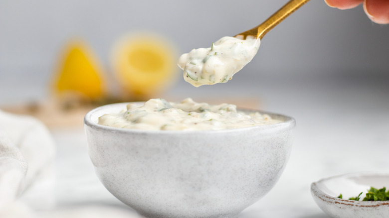 tartar sauce in bowl with golden spoon