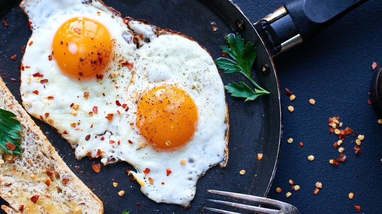 fried eggs with chili flakes