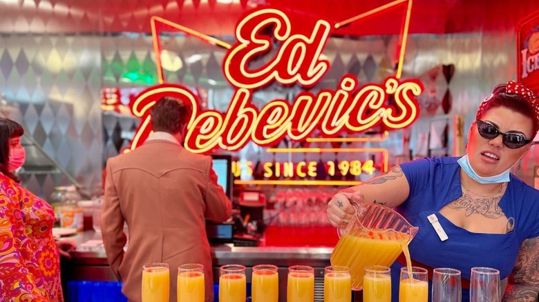 Ed Debevic's server pouring orange juice