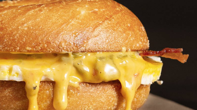 Bacon, egg, and queso bagel sandwich