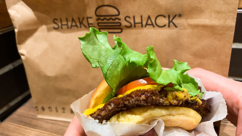 Burger in front of a Shake Shack bag